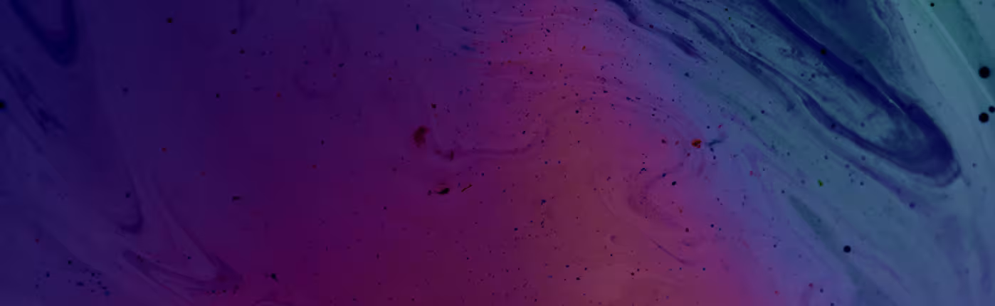 Swirls of fluid ink in purple, pink and blue-green