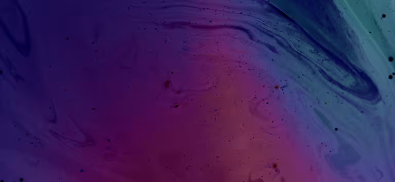 Swirls of fluid ink in purple, pink and blue-green