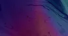 Volutes d’encre fluide violettes, roses et bleu-vert